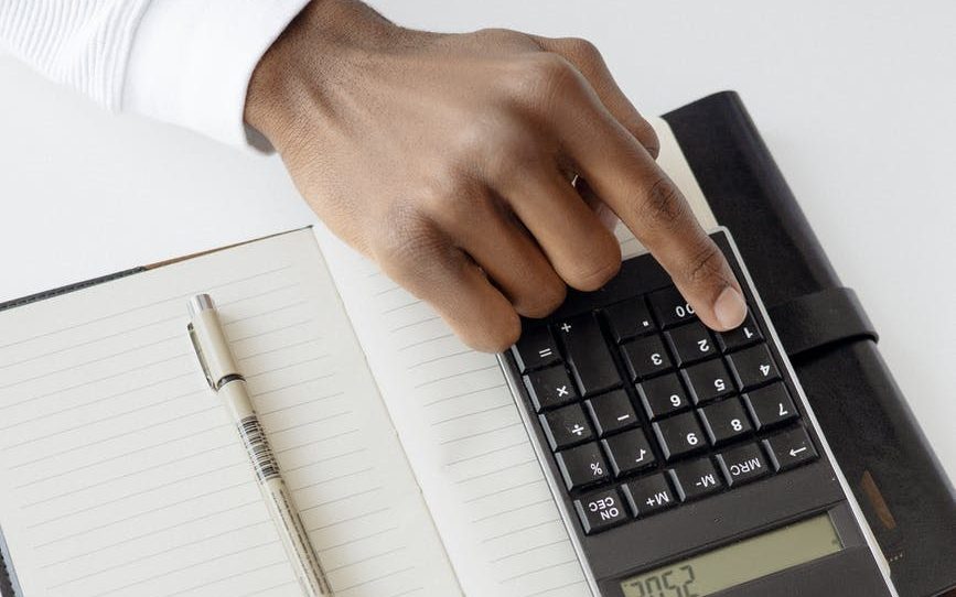 person using black calculator